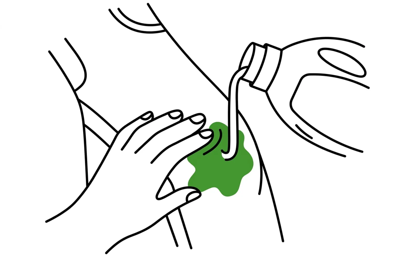 A hand working liquid detergent into a grass-green stain on the knee of a pair of children’s trousers with its fingertips